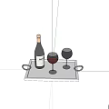 Wine Bottle with Red Wine and Two Glasses on Silver Tray with Decorative Rings