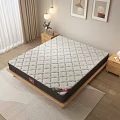 Comfortable Quilted Mattress With Diamond Pattern Light Gray Surface On Wooden Frame Modern Bedroom Setting