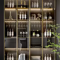 Elegant Modern Wine Cabinet With Glass Doors Gold Frame Wine Bottles Glasses And Decorations