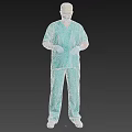 Man Wearing Green Surgical Scrubs Face Mask Surgical Cap And Blue Gloves Against Gray Background