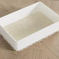 White Litter Box with Cat Litter Scattered on Wooden Floor