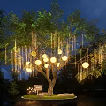 Decorative Lights Hanging From Tree With Round Lanterns And String Lights In Night Garden