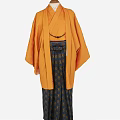 Traditional Japanese Orange Kimono With Black Obi And Patterned Skirt