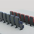 Modern Theater Seats Arranged In Blue And Red Rows With Armrests