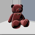 Red Velvet Teddy Bear With Green Bow Tie Sitting On White Surface Near Window