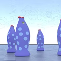 Purple Fish Shaped Art Installation With Blue Dots Red Tops Bubbles And Gray Floor