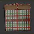 Festive Gift Box With Red And Green Plaid Pattern And Red White Striped Ribbon