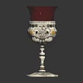 Decorative Furniture Accent with Red Glass Shade and Silver Ornate Base Featuring Detailed Decorative Patterns