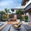 Modern Courtyard Garden With Water Fountain Wooden Deck Outdoor Dining Table And Lounge Chairs
