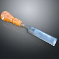 Classic Wood Chisel With Wooden Handle And Metal Blade On Dark Background