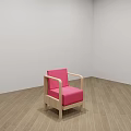 Pink Single Sofa with Wooden Frame on Wooden Floor and White Wall
