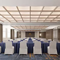 Formal Conference Room With Blue Tablecloths White Chair Covers And Grid Ceiling