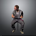 Man Sitting On Chair In Gray T Shirt And Gray Overalls With Red Details Beige Shoes On Gray Gradient Background