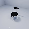 Modern Black Leisure Chair With Round Seat Curved Backrest And Metal Legs In White Room