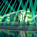 Stage Design With Green Lights Arches Steps And Silhouette Of Person