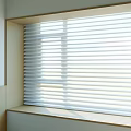 White Window Blinds Filtering Natural Light in Modern Bright Room Interior Setting 3d model