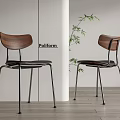 Modern Dining Chairs With Wooden Backrest Metal Legs And Green Plant Decoration
