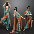 Three Women Dancing in Traditional Teal Orange Costumes With Intricate Patterns and Hairstyles