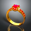 Stunning Gold Ring Featuring Central Red Gemstone And Accent Red Stones
