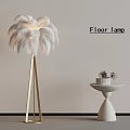 Modern Floor Lamp With White Feather Shade And Golden Stand By Side Table