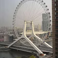 Ferris Wheel Structure Featuring White Support And Blue Water Base Design
