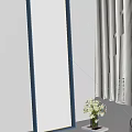 Stylish Blue Framed Mirror Reflecting White Curtains Sofa and Flowers