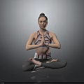 Woman Practicing Yoga In Cross Legged Pose With Namaste Hands Wearing Sportswear Against Gray Background