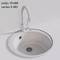 Sleek Black Round Wash Basin With Black Curved Faucet On Light Colored Countertop
