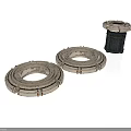 Industrial Metal Ring Components Two Flat Placed And One Upright With Black Base