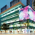 Modern Commercial Complex Featuring Glass Curtain Walls and Large Colorful LED Screen in Vibrant Night