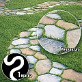 Natural Stone Ground With Green Grass Between Irregular Slabs In Outdoor Space