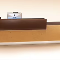 Modern Brown Reception Desk With Sleek Surface And Laptop On Top 3d model
