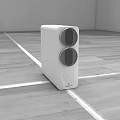 Modern White Kitchen Appliance with Two Circular Sections on Wooden Floor in Minimalist Space