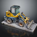 Yellow Small Loader With Front Bucket Placed On Concrete Platform Industrial Machinery