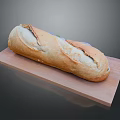 Fresh Long Loaf Bread On Wooden Cutting Board With Golden Crust