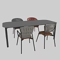 Modern Dining Table with Gray and Red Chairs Woven Design Wooden Seats Metal Frames