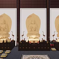 Golden Buddha Statue in Indoor Religious Setting with Worshiper Offerings and Incense Burner