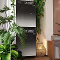 Modern Home Balcony Interior With Lush Green Plants And Wooden Storage Cabinets