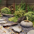 Courtyard Garden Design With Rocks Bamboo Lush Green Plants And Wooden Deck