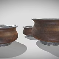 Three Wooden Ceramic Vessels With Silver Rimmed Open Tops And Textured Bodies