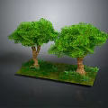 Two Lush Green Trees With Brown Trunks On Green Grass Base