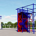 Fire Station Training Area Featuring Blue Red Metal Climbing Structure And Green Trees
