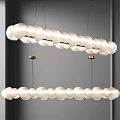 Two Hanging Modern Chandeliers With White Cloud Like Shades And Gold Metal Accents