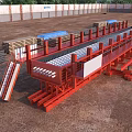Precast Bridge Components With Red Structure At Construction Site And Stacked Materials 3d model