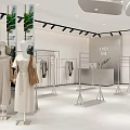 Modern Clothing Store Window Display With Dressed Mannequins Green Plants And Bright Lighting