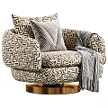 Patterned Accent Lounge Chair With Striped Pillow Throw Blanket And Gold Swivel Base
