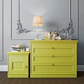 Stylish Yellow Entryway Cabinet And Side Cabinet With Table Lamp Books And Ornate Decor