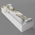 Cozy Light Colored Sectional Sofa with Soft Pillows and Fringed Woven Blankets in Living Room