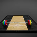 Sports Equipment Barbell With Colorful Weight Plates On Black Mat And Wooden Board