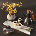 Modern Tea Set with Teapot Teacups and Decorative Tray alongside Vase with Yellow Leaves